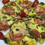 Vegetable and sausage Frittata on a white plate