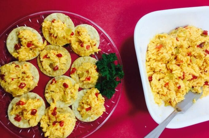 Sue’s Kicked Up Pimiento Cheese on a red tablecloth