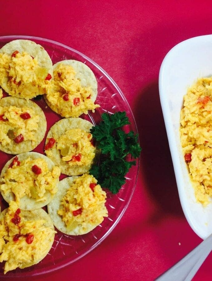 Sue’s Kicked Up Pimiento Cheese on a red tablecloth
