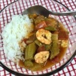 Gumbo with rice in a clear bowl