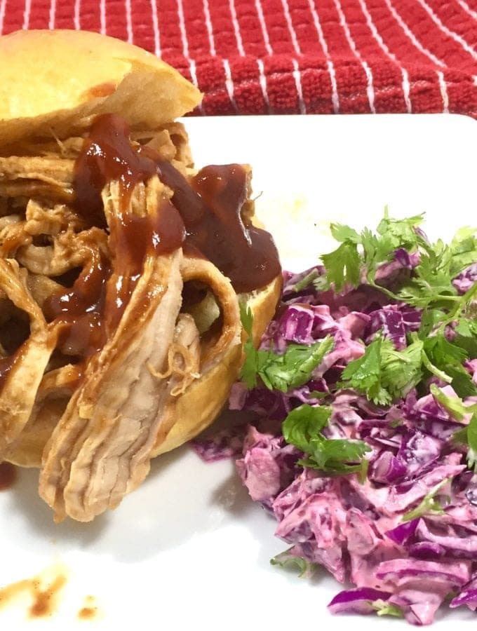 This Slow Cooked Sriracha BBQ Pork is perfect for the best spicy pork sliders you’ll ever eat. And even better is how easy this recipe is to make.