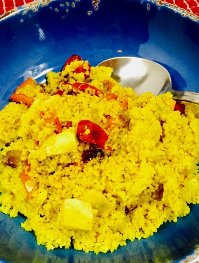 Curry Couscous and vegetables ina blue bowl