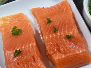 Fresh salmon on a white plate