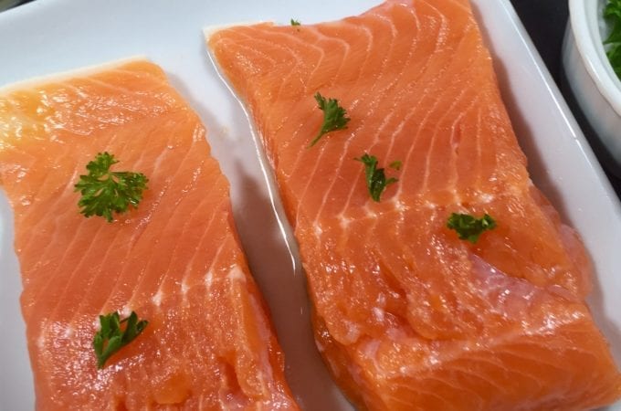 Fresh salmon on a white plate