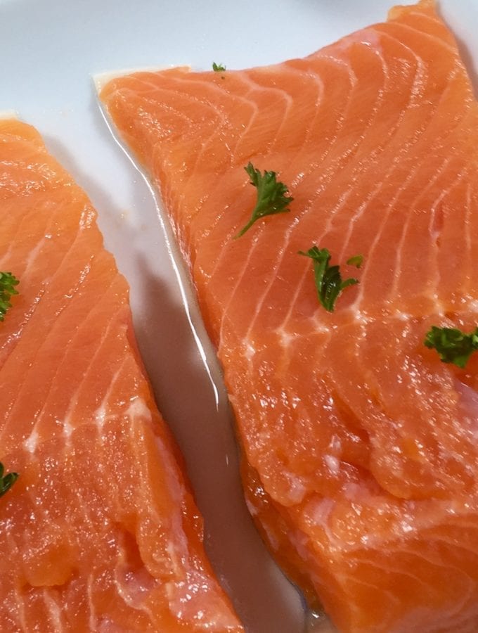 Fresh salmon on a white plate