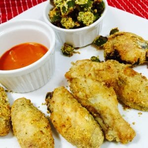 Crispy chicken wings with sauce and okra