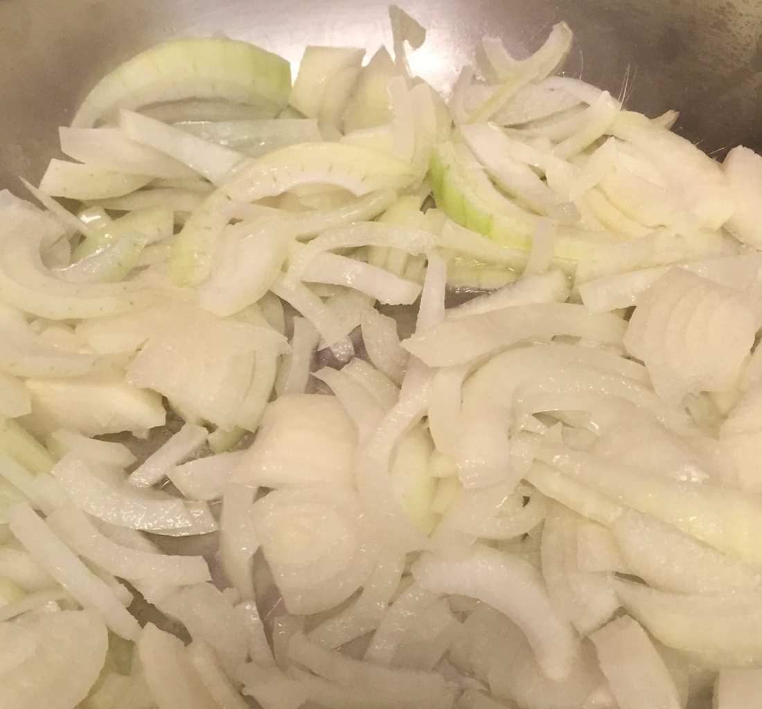 Onions cooking in a pan