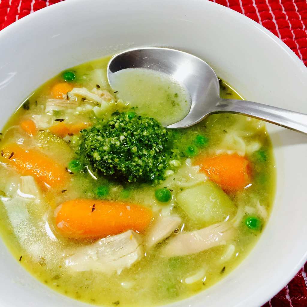 Chicken Pesto Soup in a white bowl as the number 1 Chicken Soup Recipes