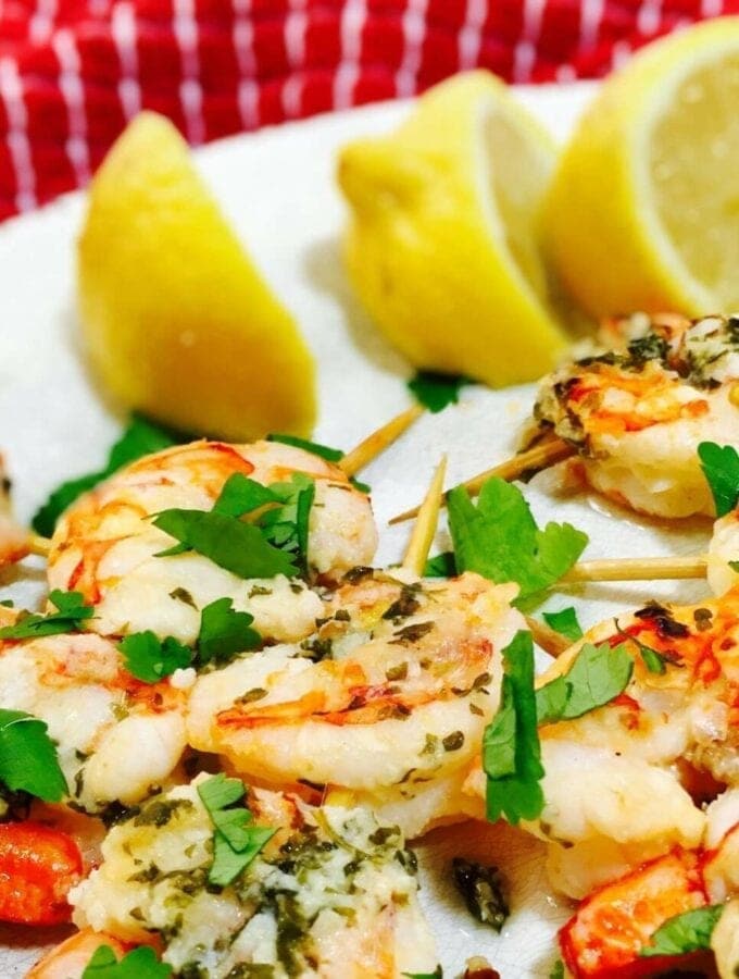 Shrimp Scampi Skewers on a white plate