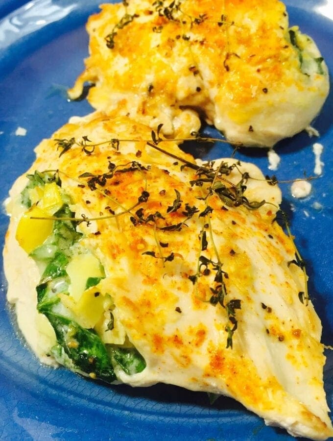 Baked Stuffed chicken on a blue plate