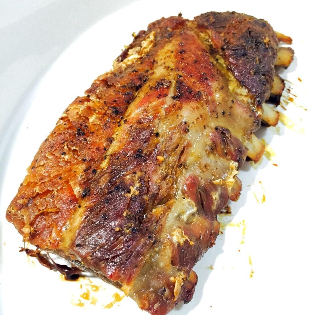 Barbecued ribs on a white plate