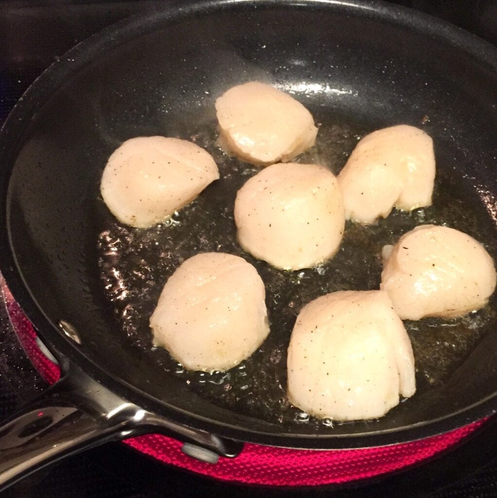 Sea Scallops searing in a saute pan
