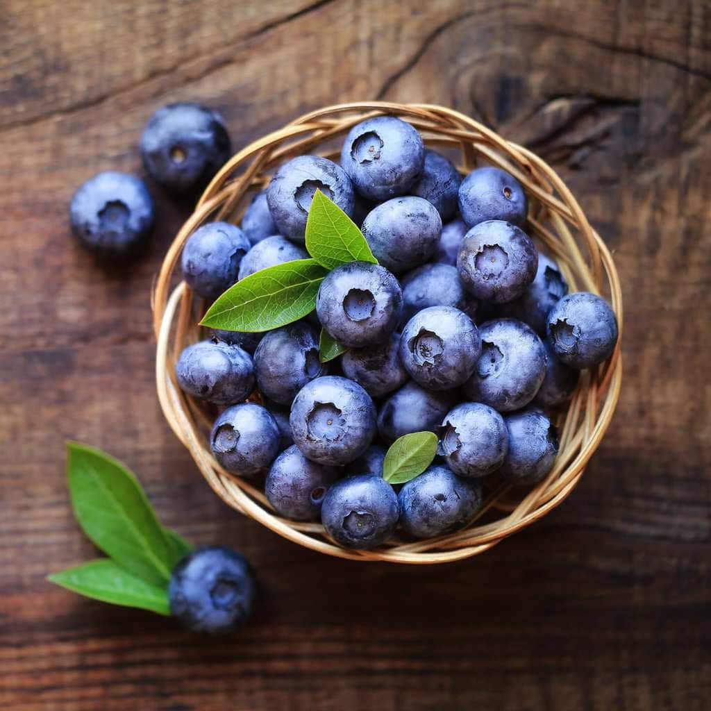 Blueberries in a Basket On a wooden table