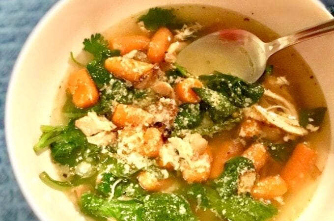 French Country Soup in a white bowl on a blue table cloth