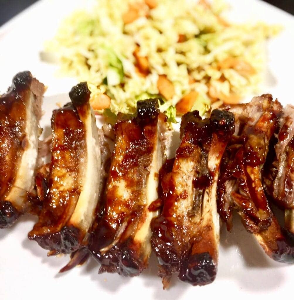 BBQ Ribs with coleslaw on a white plate