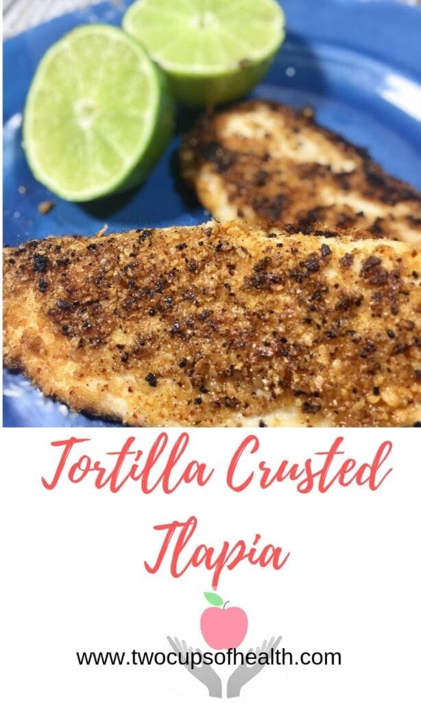 tortilla crusted tilapia with limes on a blue plate
