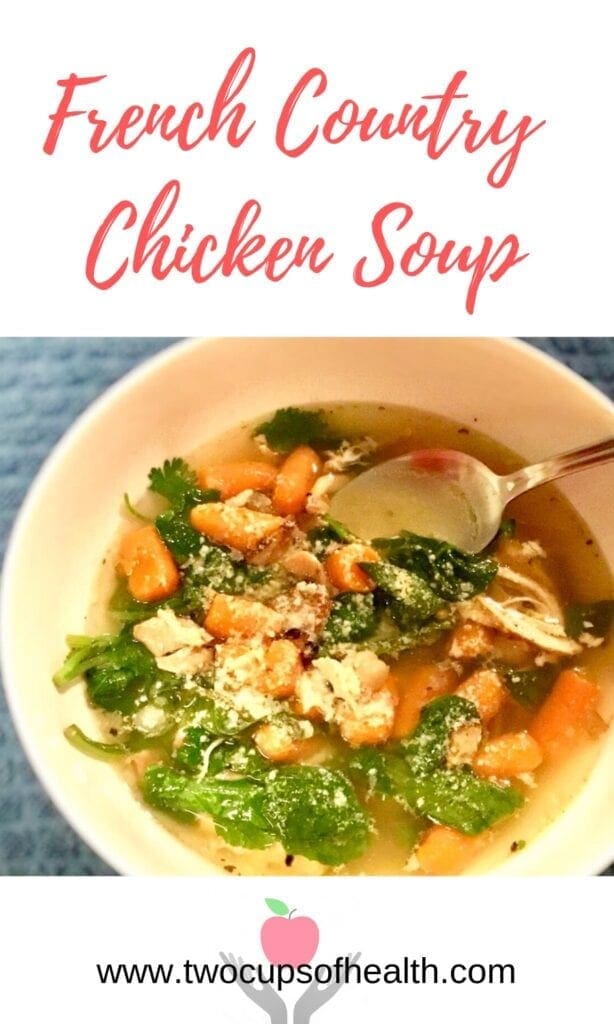 French Country Chicken Soup in a white bowl on a blue tablecloth