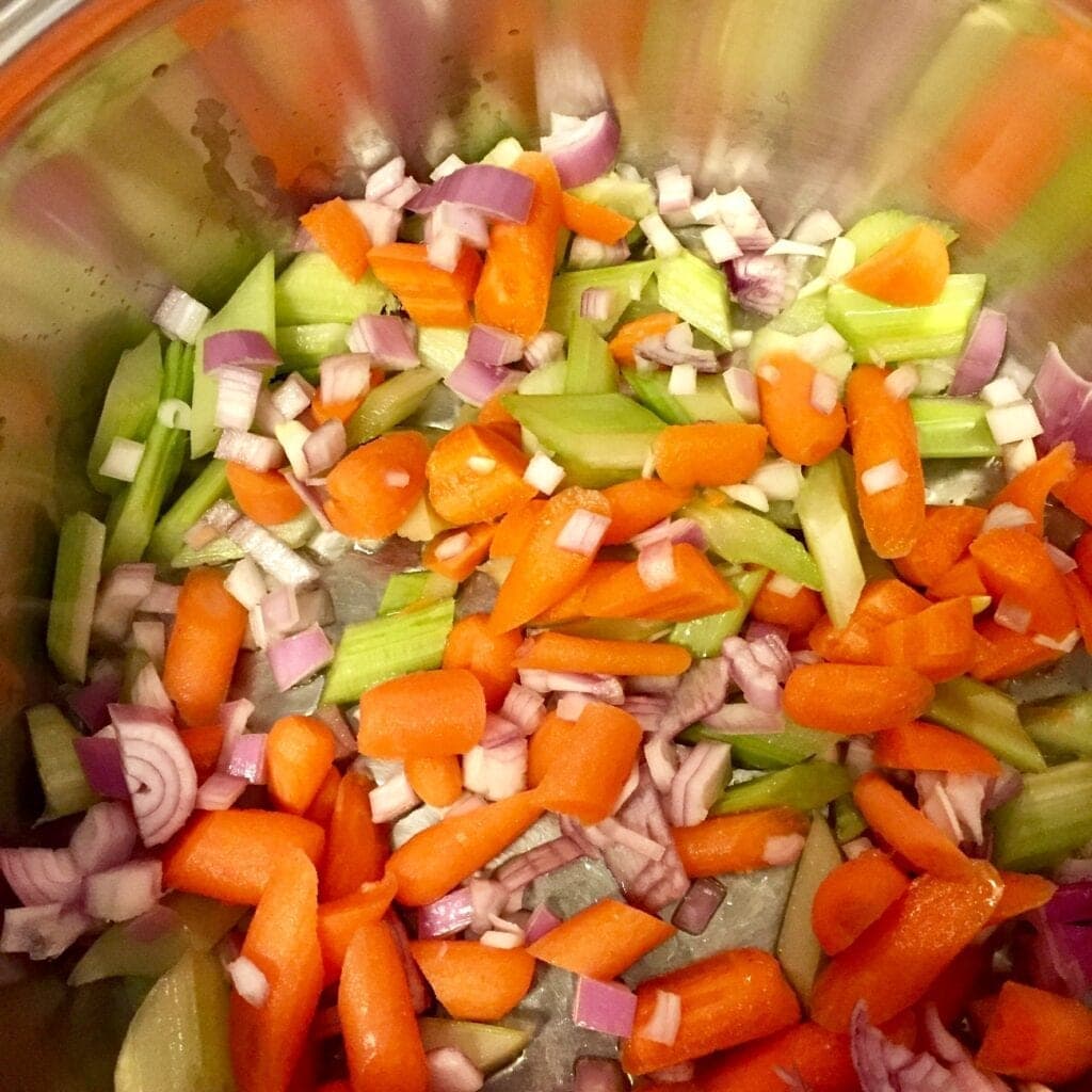 simmering vegetables in a soup pot