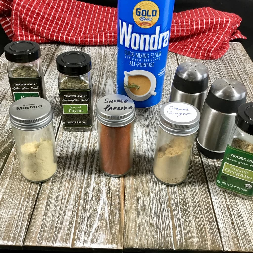 Four and spices and herbs on a wooden table