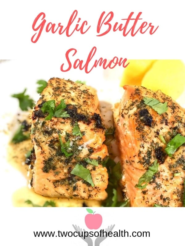 Garlic butter salmon on a white plate