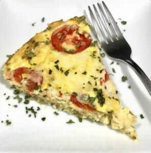 Amazing Zucchini and Potato Frittata on a white plate