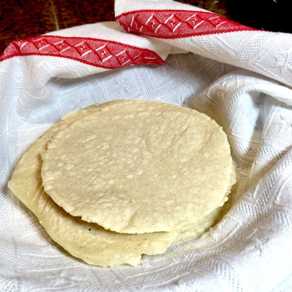Homemade tortillas in a white towel