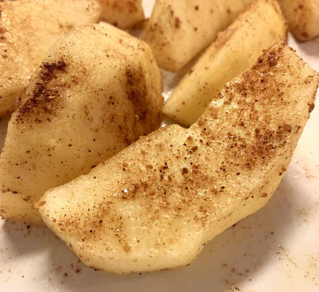 Spiced apples on a white plate