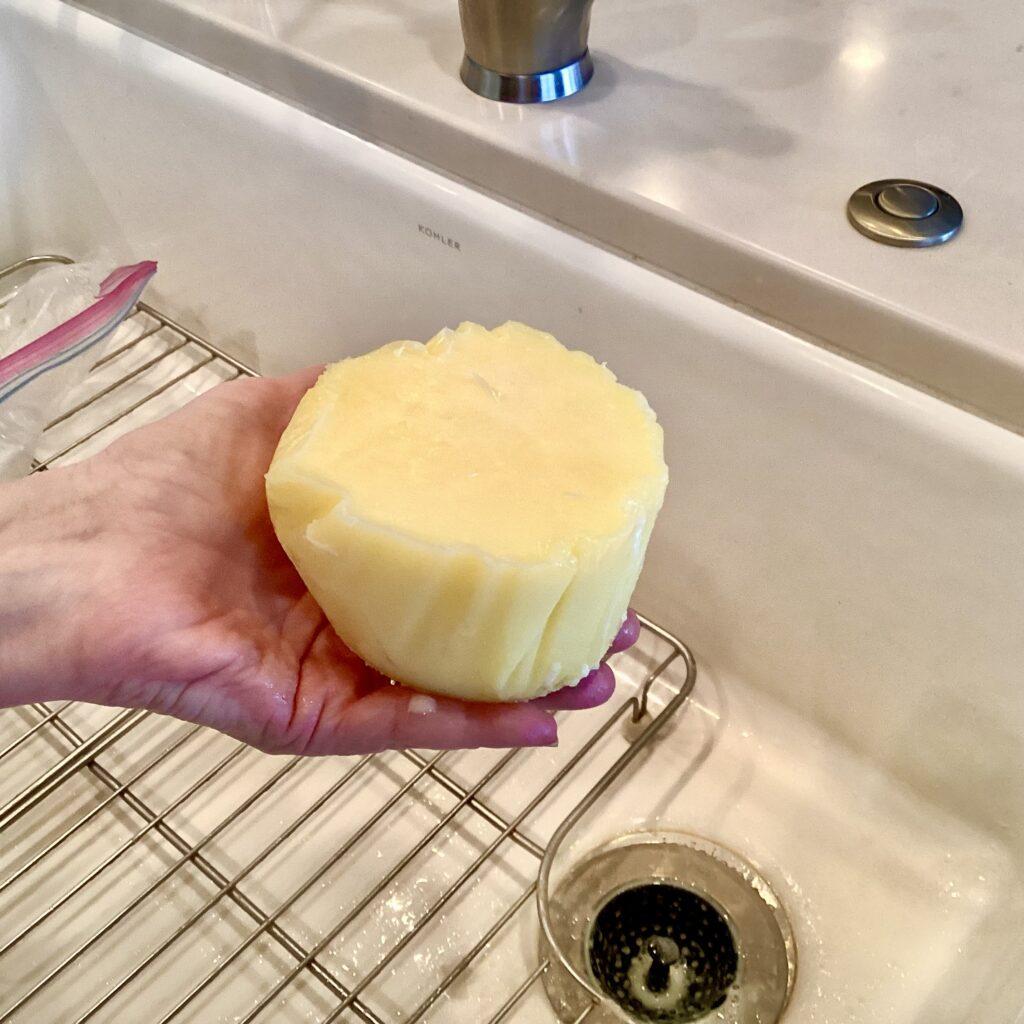 Clarified butter in palm of hand