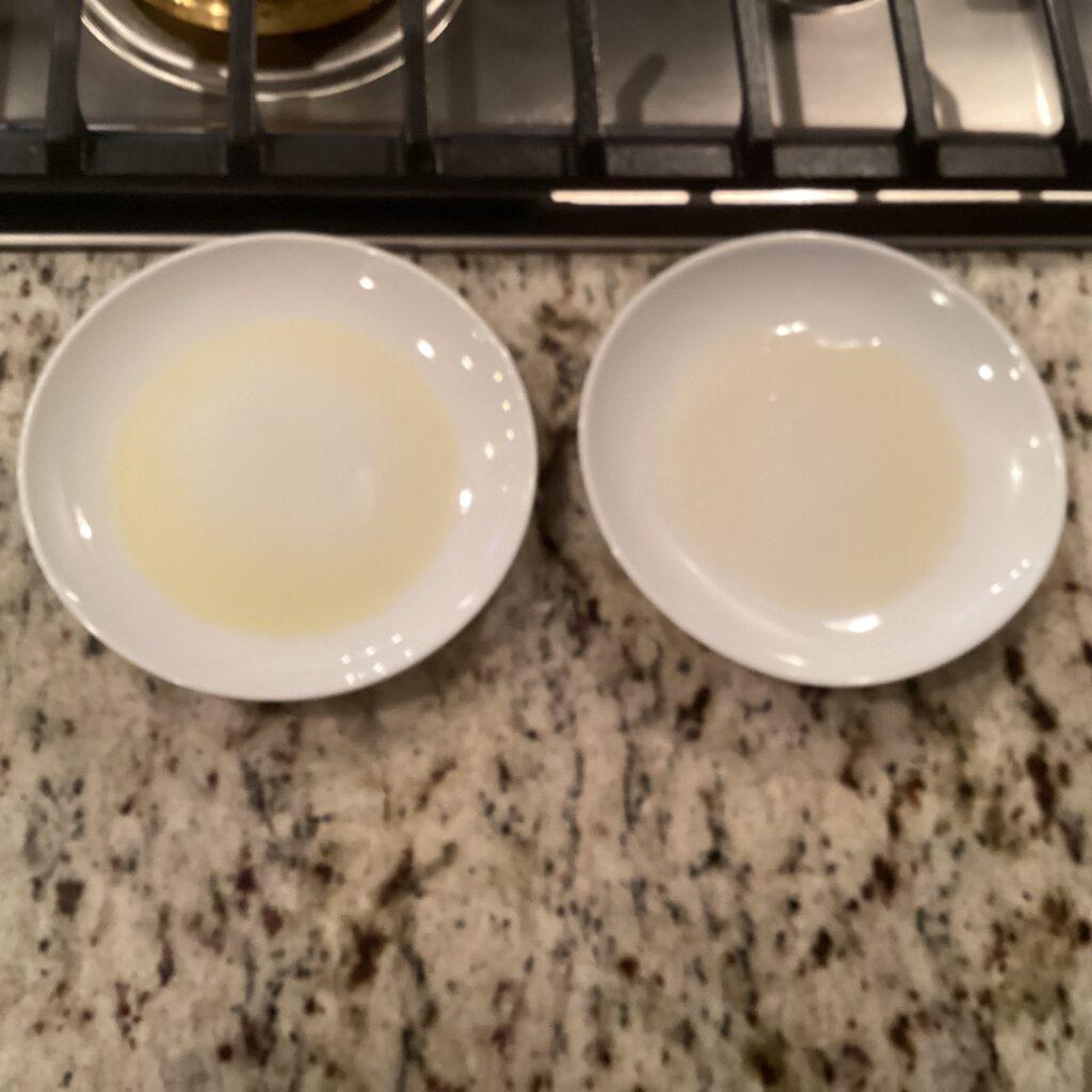 Two plates containing homemade clarified butter and store purchased clarified butter
