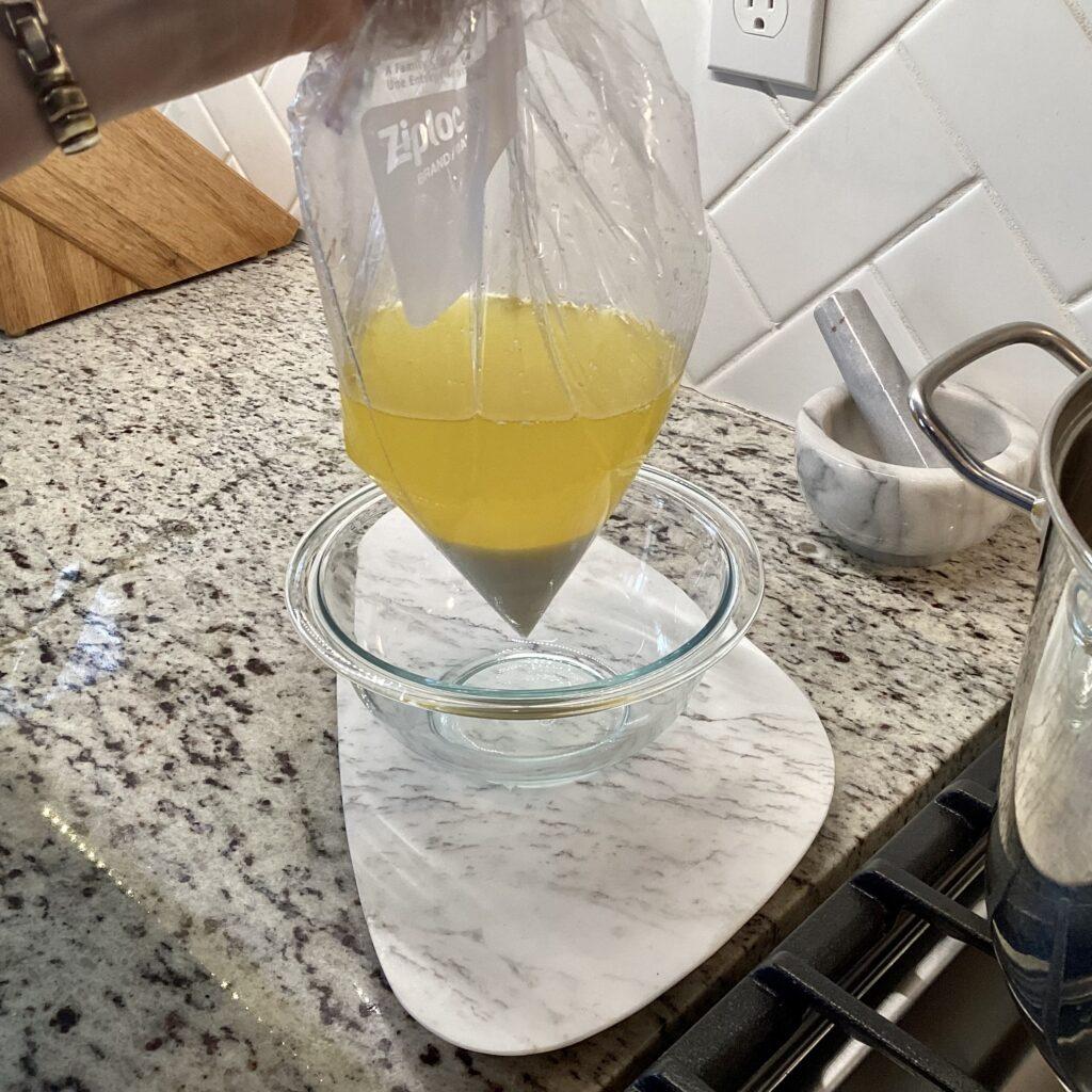 Gallon ziplock showing separation of clarified butter and liquid milk solids