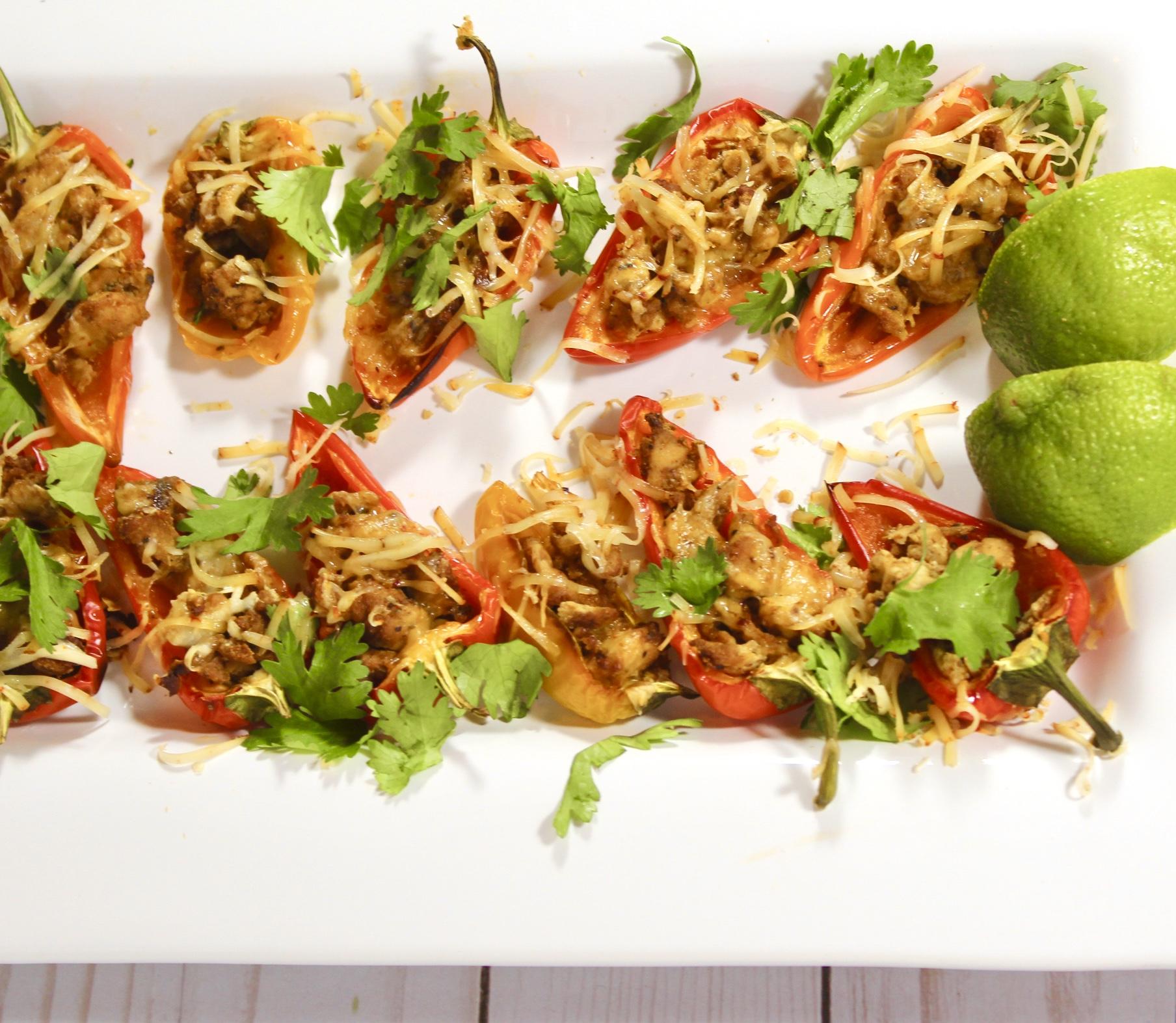 Fajita Poppers on a white plate with limes